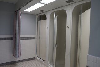 Busey Evans communal bathroom with private shower stalls