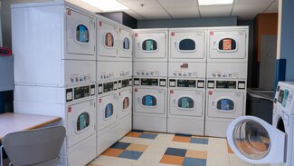Scott laundry room with stacked dryers