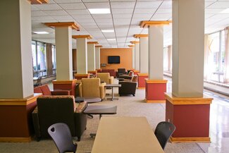 Hopkins lounge with chairs, tables and columns